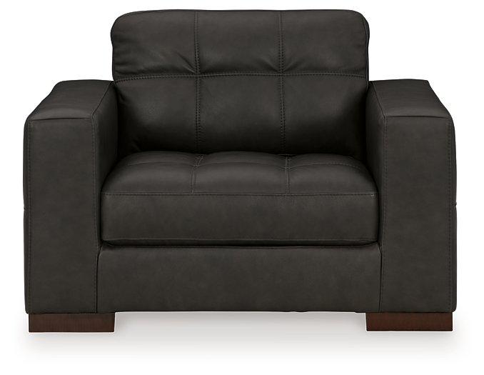 Ashley Luigi oversized chair with plush fabric and wide armrests, showcasing a modern, comfortable design.