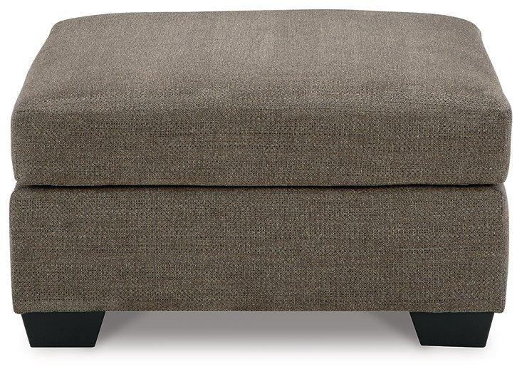 Mahoney oversized accent ottoman by Ashley Furniture featuring plush fabric and a sturdy wooden base in a contemporary design.