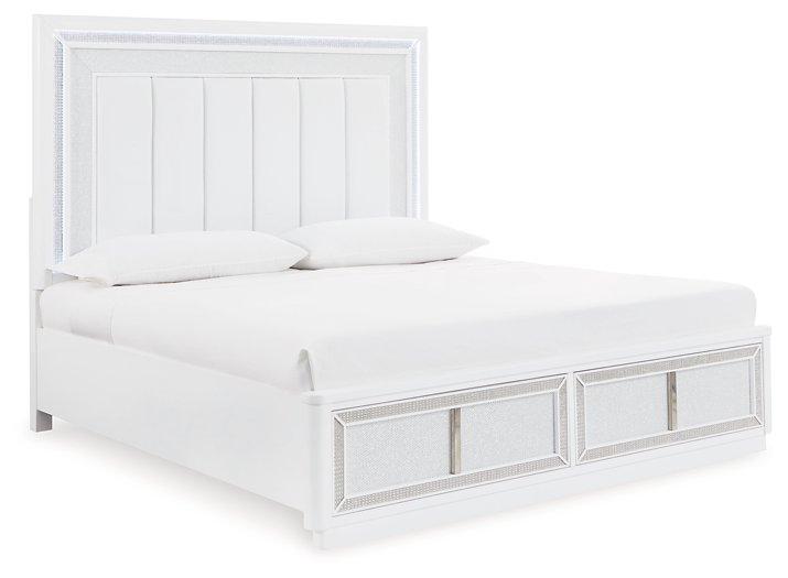 Ashley Furniture Chalanna upholstered storage bed with tufted headboard and built-in storage drawers in a modern bedroom setting.