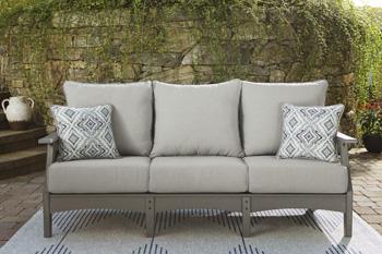 Ashley Furniture Visola outdoor sofa and loveseat set with matching table, featuring cushioned seating and stylish outdoor design.