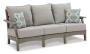 Outdoor seating set with sofa, loveseat, and coffee table by Ashley Furniture, featuring cushioned seats and a modern design.