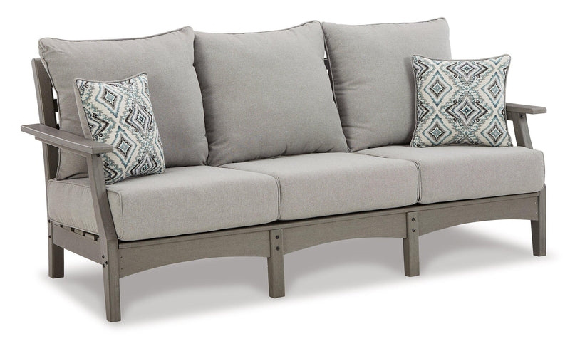 Outdoor seating set with sofa, loveseat, and coffee table by Ashley Furniture, featuring cushioned seats and a modern design.