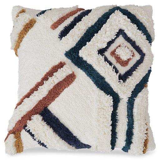 Set of four Ashley Furniture Evermore pillows with textured fabric and decorative patterns, arranged on a neutral sofa.