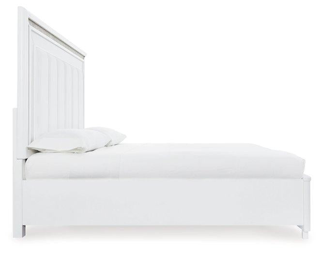 Ashley Furniture Chalanna upholstered storage bed with a padded headboard and built-in storage drawers in a modern bedroom setting.