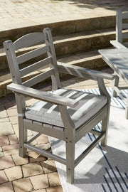 Ashley Visola outdoor dining table with four chairs, weather-resistant patio set for outdoor entertaining and gatherings.