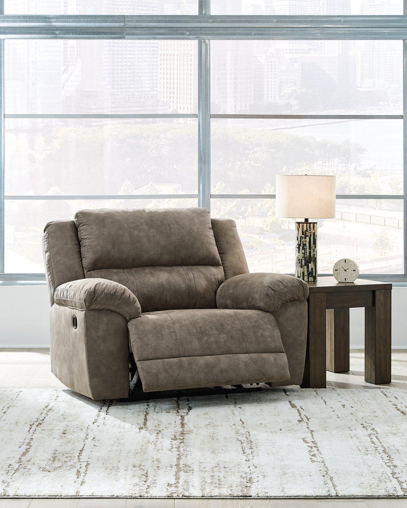 Ashley Furniture Laresview oversized recliner showing plush fabric, wide armrests, and a comfortable reclining position.