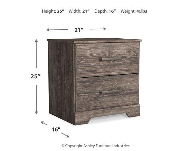Ashley Furniture Ralinksi nightstand with a sleek wooden finish and drawer storage, ideal for bedroom decor.
