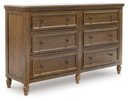 Ashley Furniture Sturlayne dresser with matching mirror, showcasing a modern wood finish and ample storage space.