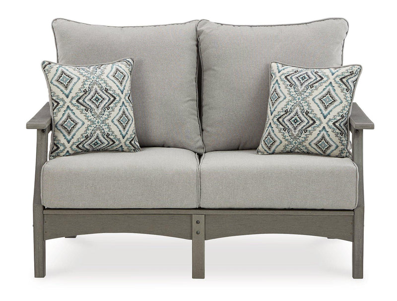 Ashley Furniture Visola outdoor loveseat conversation set with cushioned seats, outdoor coffee table, and stylish weather-resistant design.