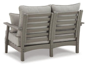 Outdoor loveseat conversation set by Ashley Furniture with cushioned seats and a coffee table, ideal for patio relaxation.