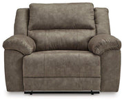 Ashley Furniture Laresview oversized recliner in beige fabric with plush cushioning and wide armrests, ideal for relaxing.