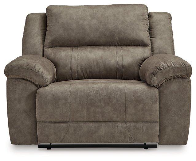 Ashley Furniture Laresview oversized recliner in beige fabric with plush cushioning and wide armrests, ideal for relaxing.