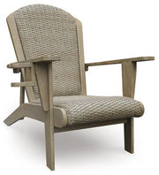 Outdoor table set with chairs in a sunny patio, part of the Marina Sun Outdoor Package by Ashley Furniture.