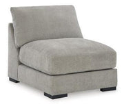 Ashley Furniture Aslan Court Sectional sofa with plush cushions and fabric upholstery in a spacious living room setting.