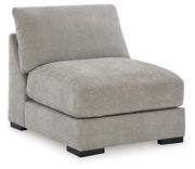 Ashley Furniture Aslan Court sectional sofa with plush cushions and modern design, shown in a stylish living room setting.