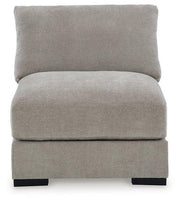Ashley Furniture Aslan Court Sectional sofa with plush cushions and modern design, shown in a stylish living room setting.