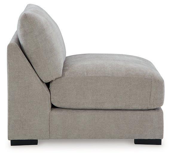 Ashley Furniture Aslan Court sectional sofa with plush cushions and neutral fabric, arranged in a modern living room setting.