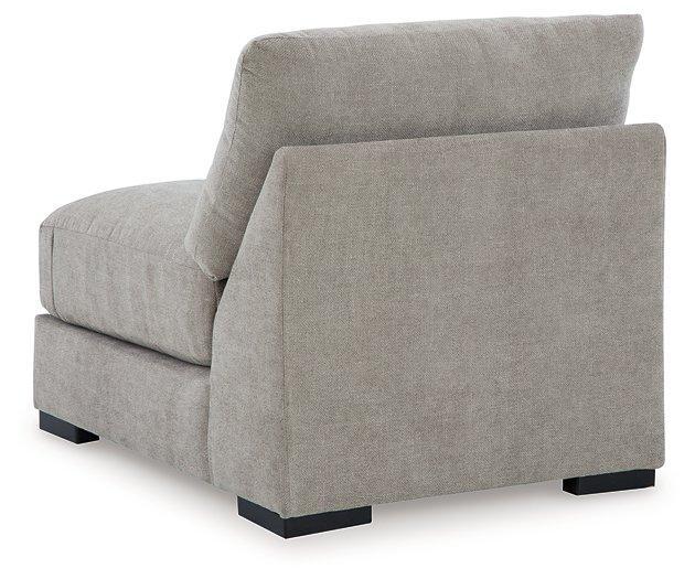 Ashley Furniture Aslan Court sectional sofa with plush cushions and modern design, shown in a cozy living room setting.