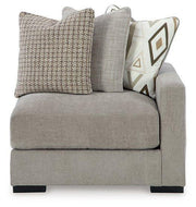 Ashley Furniture Aslan Court sectional with plush fabric upholstery and modern design, shown in a spacious living room setting.
