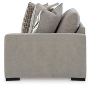 Ashley Furniture Aslan Court Sectional sofa with plush cushions and neutral fabric in a modern living room setting.