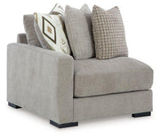 Ashley Furniture Aslan Court sectional sofa with plush cushions and modern design, shown in a stylish living room setting.