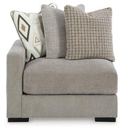 Ashley Furniture Aslan Court Sectional sofa with plush cushions and modern design in a cozy living room setting.