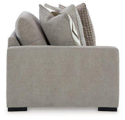 Ashley Furniture Aslan Court Sectional sofa with plush cushions and modern design, shown in a cozy living room setting.