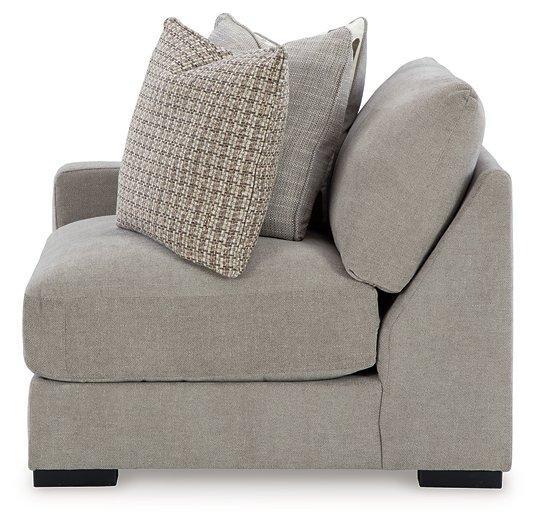 Ashley Furniture Aslan Court sectional sofa with plush cushions and modern design, shown in a stylish living room setting.