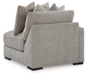 Ashley Furniture Aslan Court sectional sofa with plush cushions and fabric upholstery, shown in a modern living room setting.