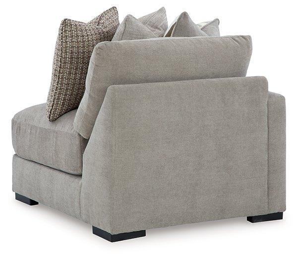 Ashley Furniture Aslan Court sectional sofa with plush cushions and fabric upholstery, shown in a modern living room setting.