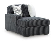 Ashley Furniture Midnight-Madness Super Chaise sectional in dark upholstery with plush cushions and modern design.