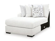 Misty-Lakes Super Chaise sectional sofa by Ashley Furniture with plush cushions and neutral fabric in a modern living room setting.