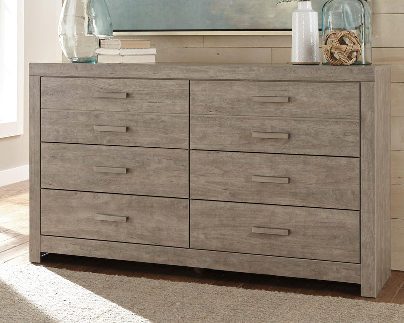 Ashley Furniture Culverbach Dresser with polished wood finish and multiple drawers, showcasing a stylish and functional bedroom storage piece.
