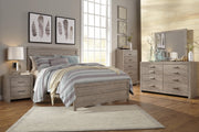 Ashley Furniture Culverbach dresser with matching mirror, featuring wood finish, multiple drawers, and elegant design.