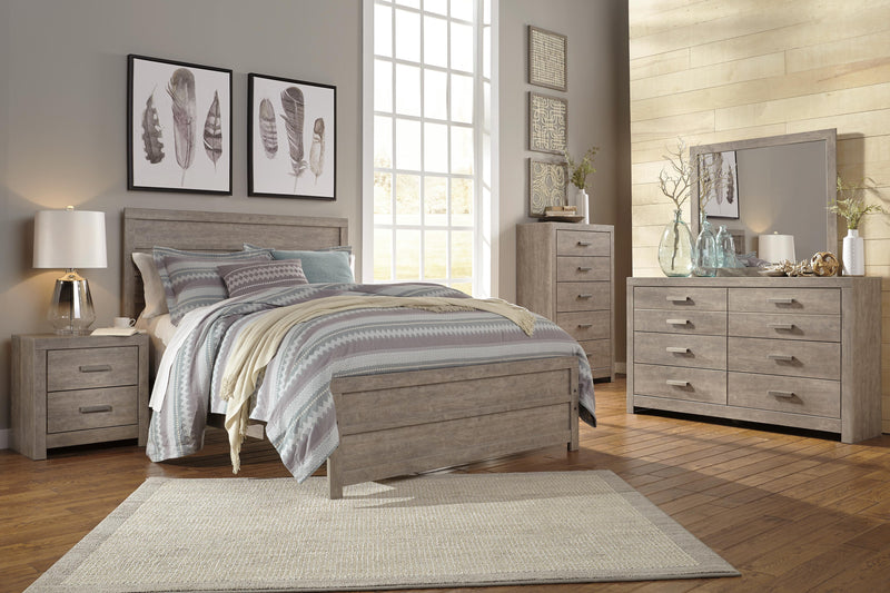 Ashley Furniture Culverbach dresser with matching mirror, featuring wood finish, multiple drawers, and elegant design.