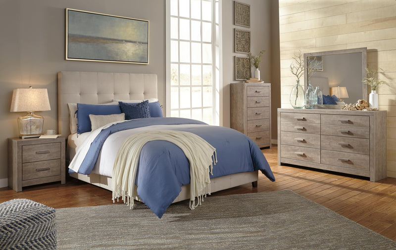 Ashley Furniture Culverbach chest of drawers with multiple drawers in a dark wood finish, detailed hardware, and classic design.