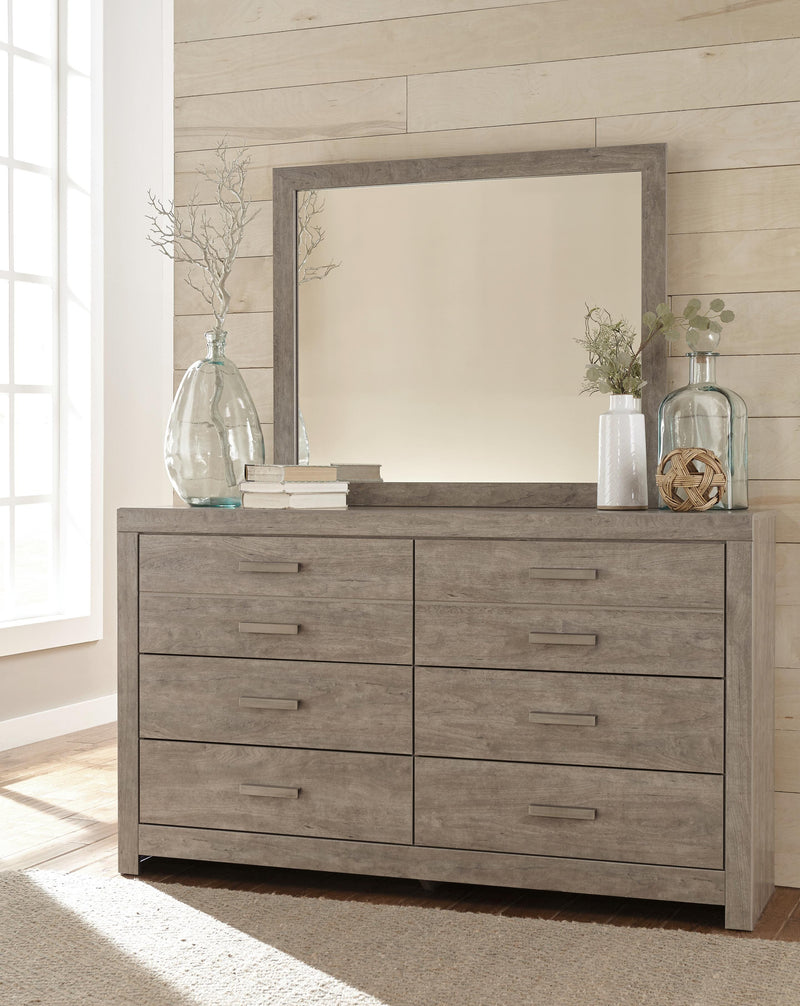 Ashley Furniture Culverbach dresser with six drawers and sleek dark wood finish, featuring modern silver handles.