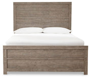 Ashley Furniture Culverbach Bed with a sleek headboard and classic design, shown in a stylish bedroom setting.