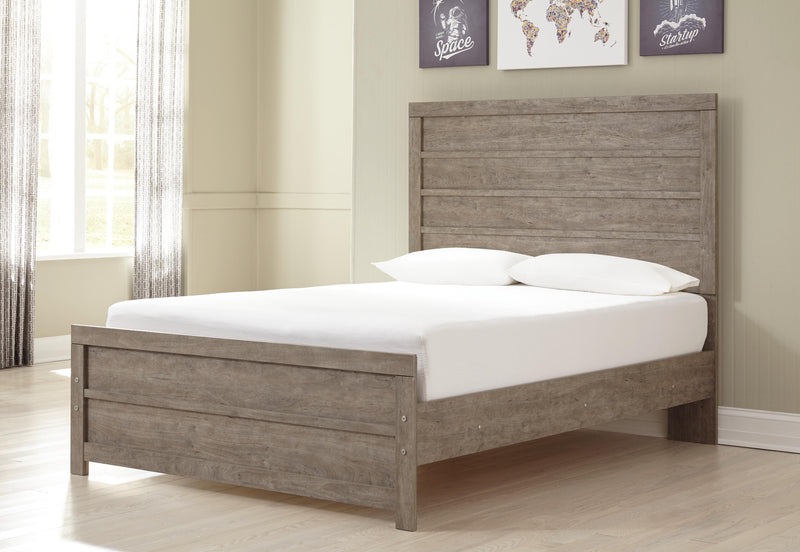 Ashley Furniture Culverbach youth bedroom set with a bed, dresser, and nightstand, featuring a modern design in a bedroom scene.