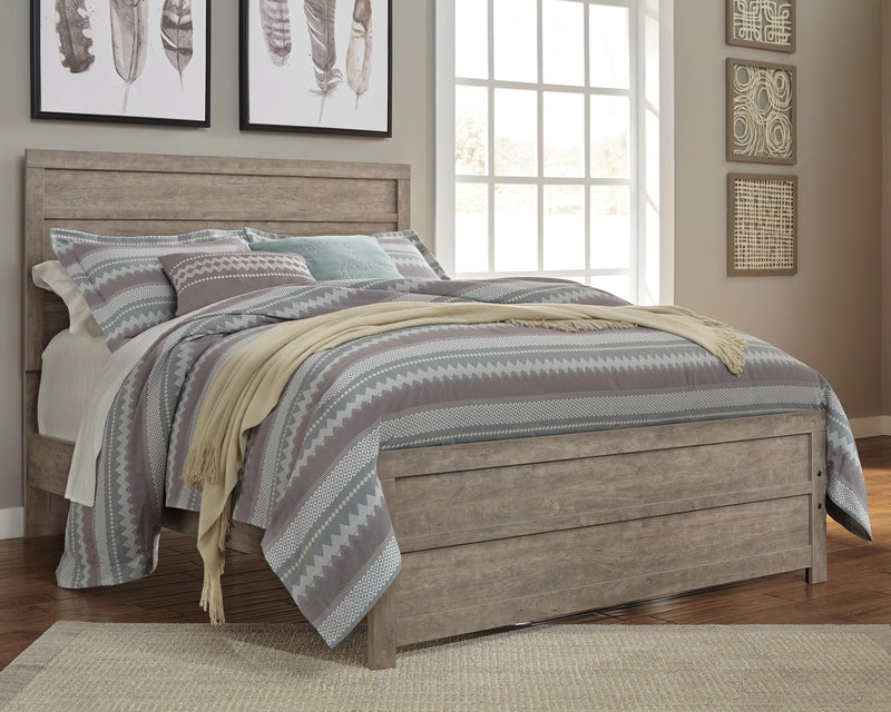 Ashley Furniture Culverbach Bed with upholstered headboard and wooden frame, shown in a close-up view.