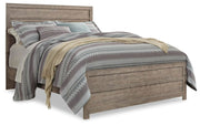 Ashley Furniture Culverbach Bed with a wooden frame and elegant design, shown in a cozy bedroom setting.