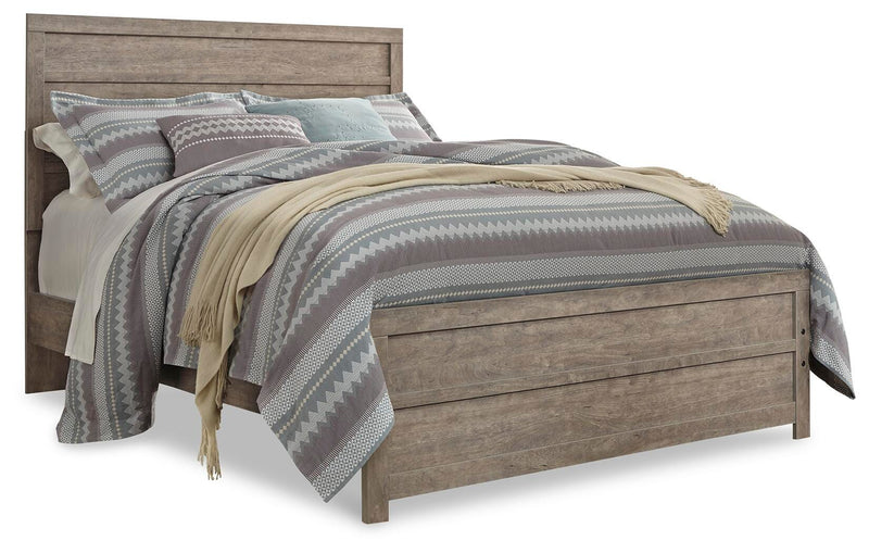Ashley Furniture Culverbach Bed with a wooden frame and elegant design, shown in a cozy bedroom setting.