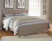 Ashley Furniture Culverbach Bed with a classic wooden frame and elegant design, shown in a cropped view.