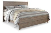Ashley Furniture Culverbach Bed with a classic wooden frame and elegant design, shown in a cozy bedroom setting.