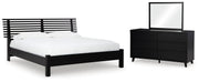 Ashley Furniture Danziar bedroom set includes a bed frame, nightstands, and dresser with modern design and neutral finish.
