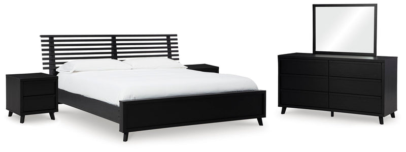 Ashley Furniture Danziar bedroom set featuring a modern bed frame, matching nightstands, and a coordinated bedroom furniture design.