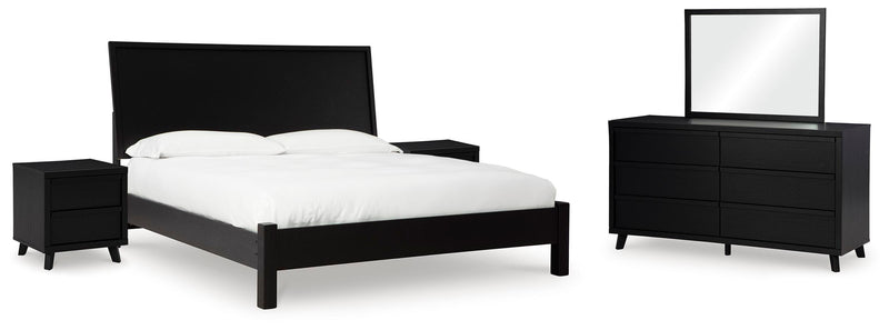 Ashley Furniture Danziar bedroom set with a modern bed frame, matching nightstands, and dresser in a stylish bedroom setup