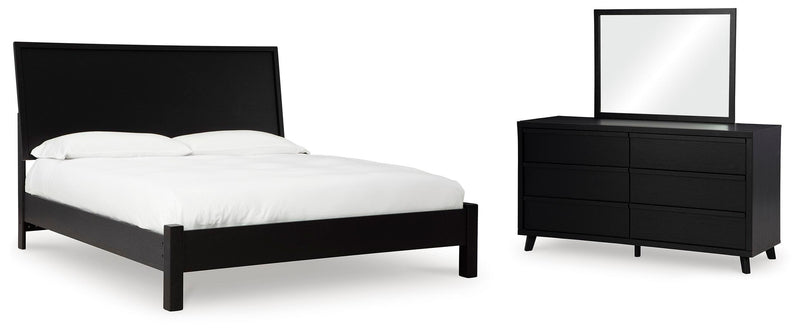 Ashley Furniture Danziar bedroom set featuring a bed frame, nightstands, and matching dresser in a modern design.