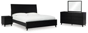 Ashley Furniture Danziar bedroom set with a modern bed frame, matching nightstands, and dresser in a stylish bedroom arrangement.