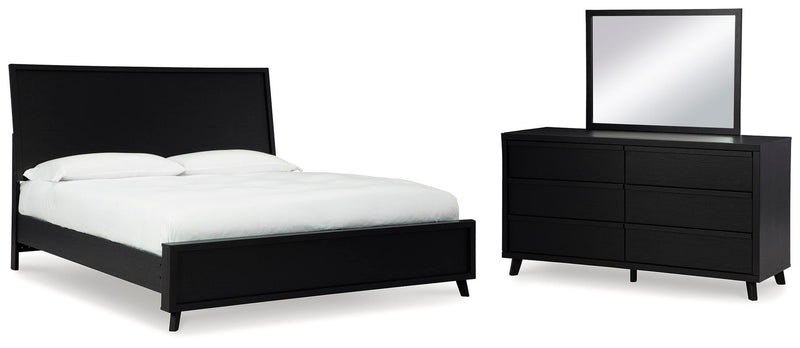 Ashley Furniture Danziar bedroom set featuring a bed frame, matching nightstands, and dresser in a modern design.
